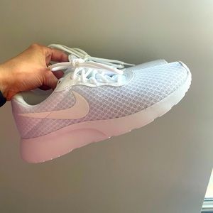 White Nike running shoes